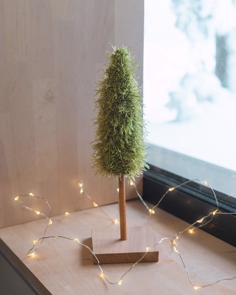 Picture of Single fluffy Christmas Tree with wooden base